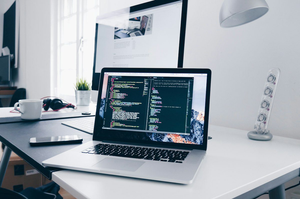 Laptop displaying a software development workspace during post-update testing